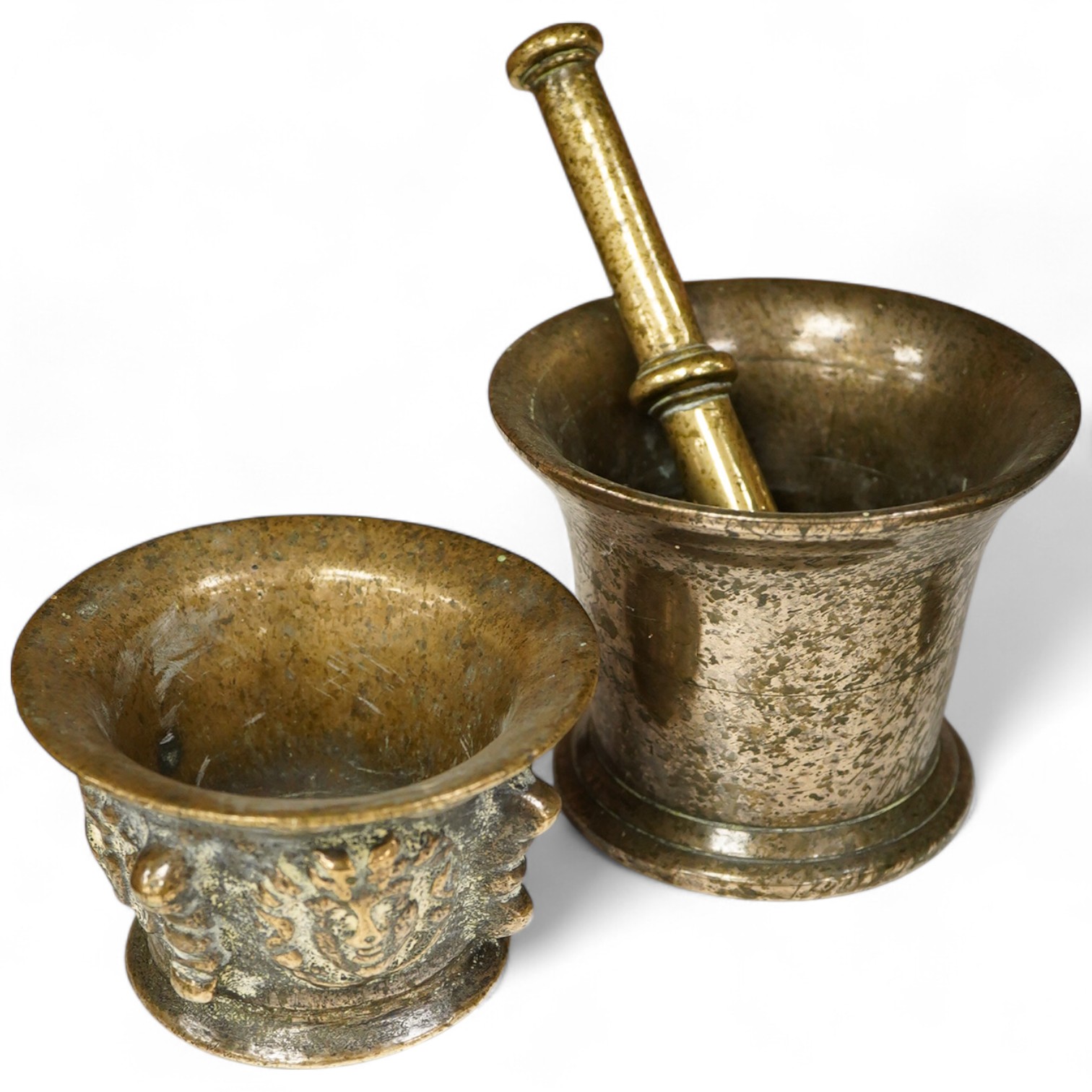 A bronze pestle and mortar, and one other mortar decorated in relief, 18cm in length